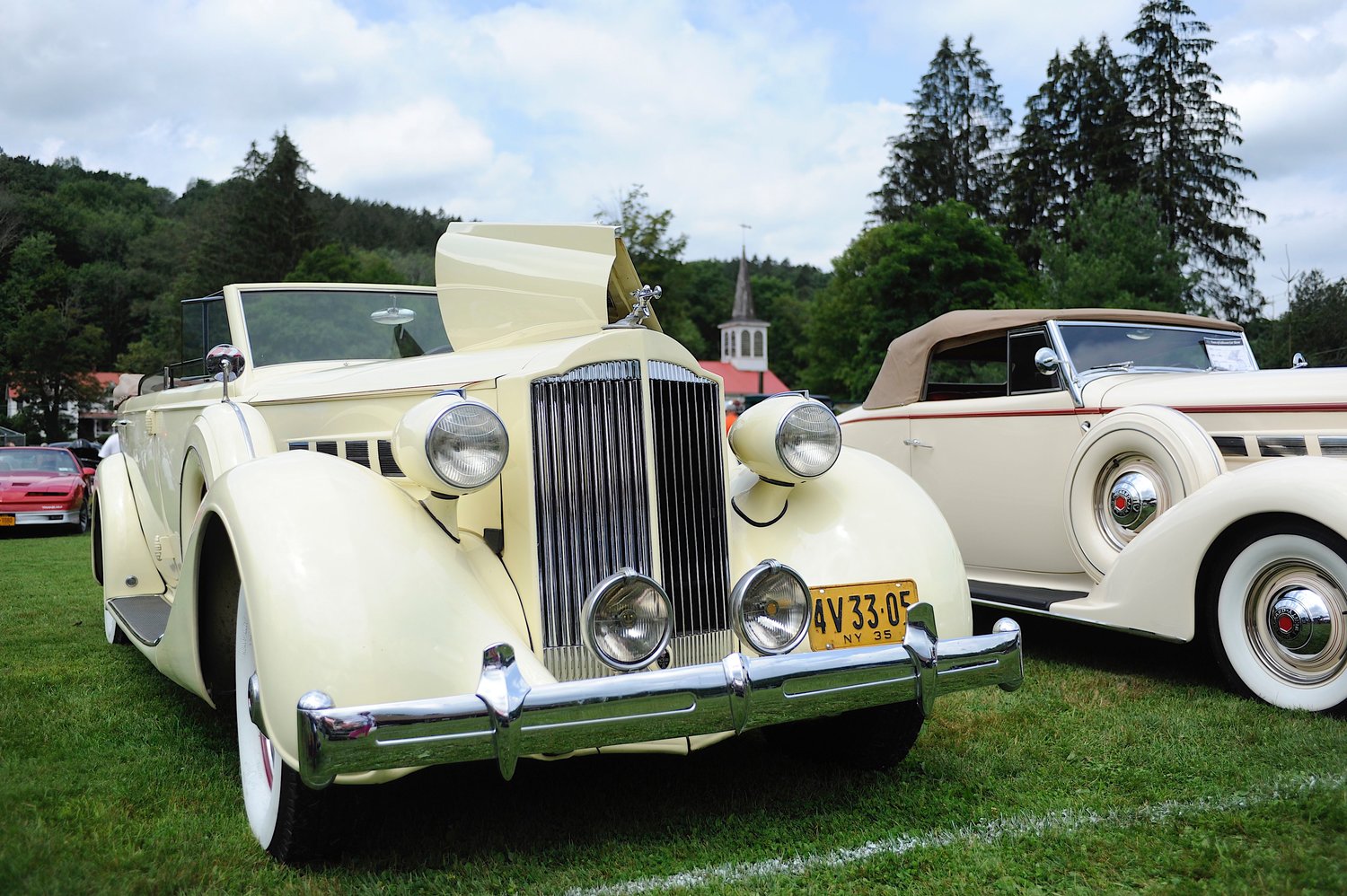 Pretty as a Packard. Allan and Pat Kehrley displayed their 1935 Packard 4-door convertible sedan, with bodywork by Dietrick, next to Flynn’s ’37 rumble seat roadster...